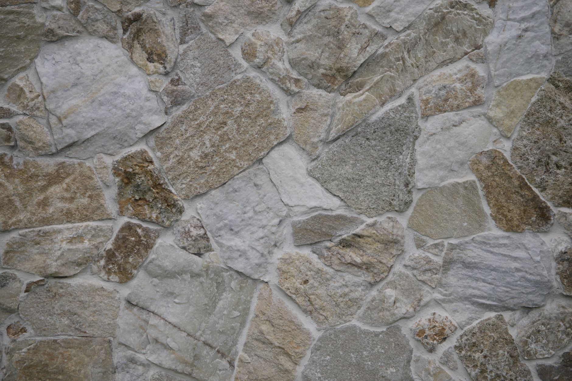 Mur en pierre naturelle taillée, texture beige